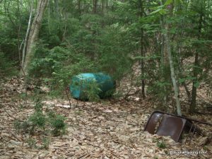 Green barrel & folding chair north of Negro Lake
